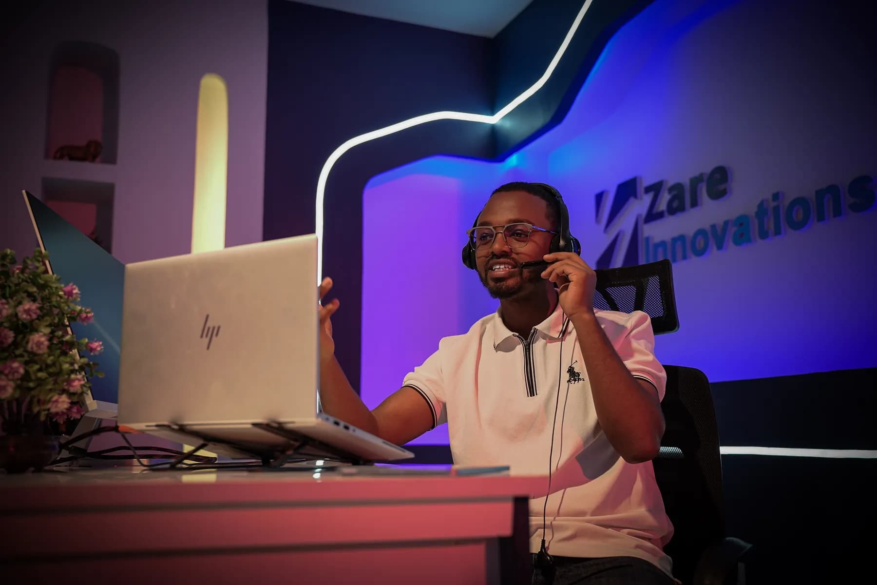 A Zare operations specialist on a client call, wearing a headset