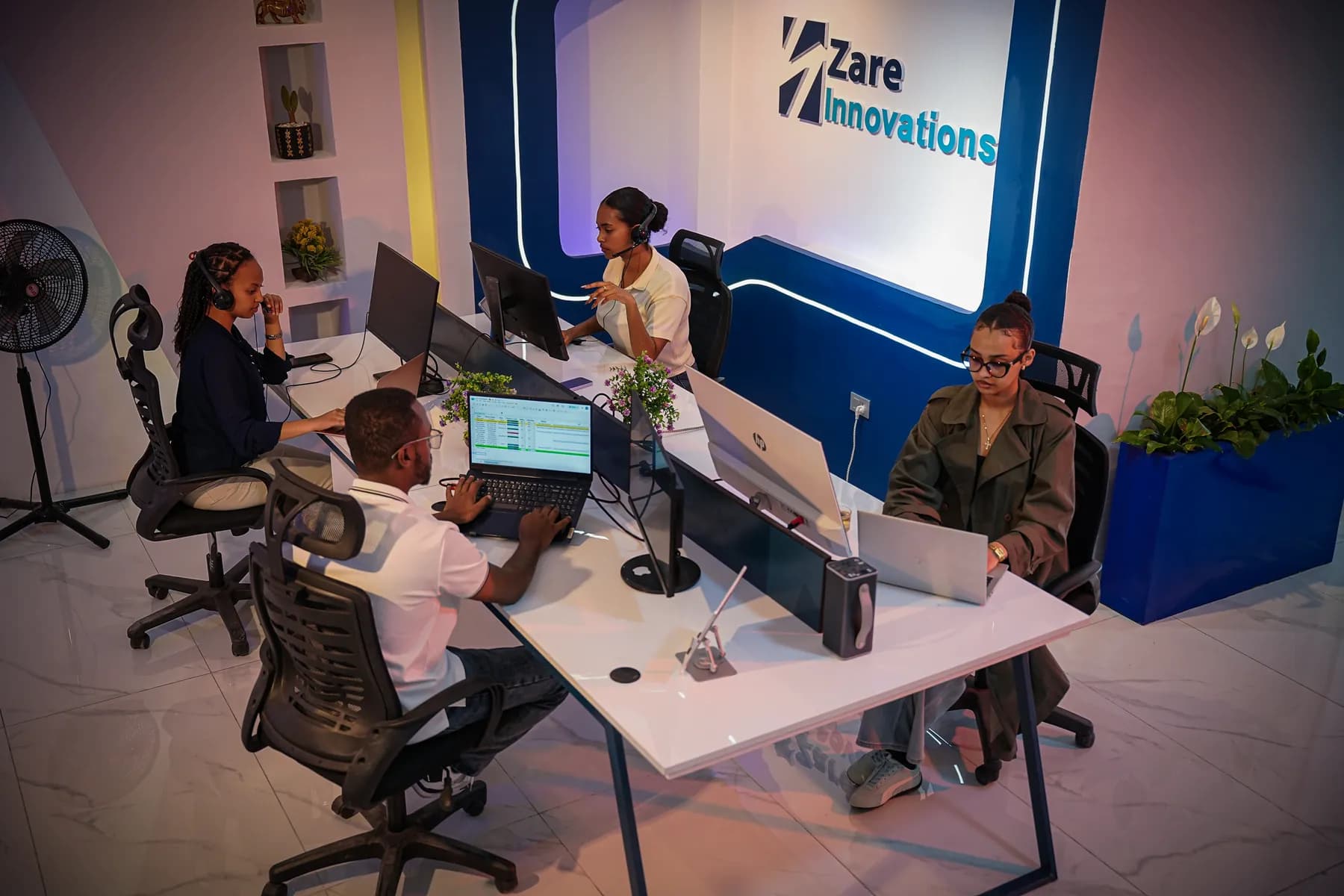 Engineers working at their desks in the Zare delivery centre, Addis Ababa